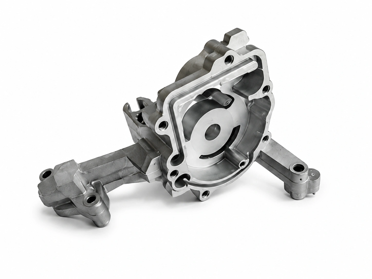 Precision aluminum die-cast automotive housing with machined mounting holes, internal channels, and structural ribs on a white background.